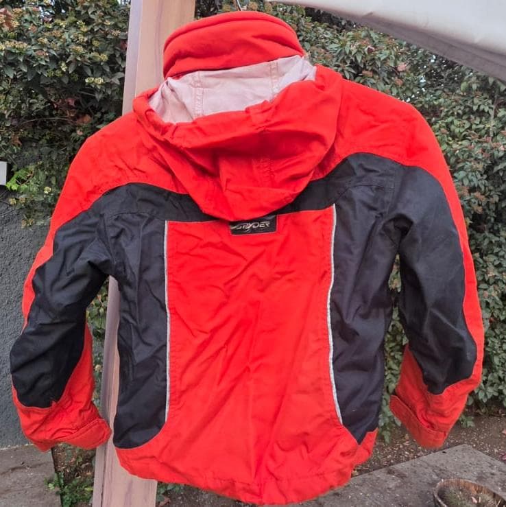 Parka de esqui Spyder naranjo con polar integrado talla 8